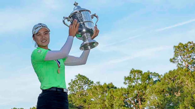 Minjee Lee poses with the 2022 U.S. Women's Open trophy.